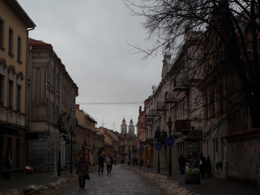 People walk through a central street in Kaunas, Lithuania's second-largest city
