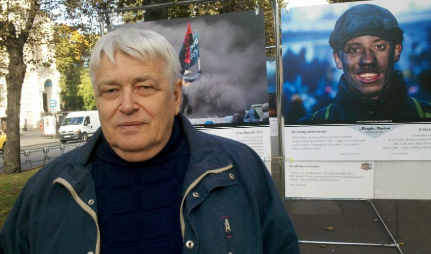 Photographer Sergey Melnikoff at the exhibit 'The People of Maidan' in downtown Riga..