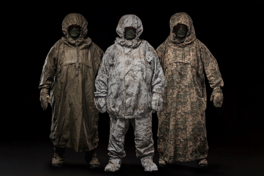 Photo: Thermal Signature Poncho and Suit by STG Defence in Olive, Arctic, and Pixel patterns.